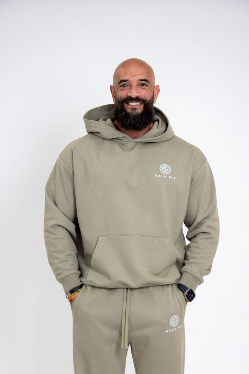 Sahara Hoodie - Sage Dune
80% cotton, 20% polyester
440gsm cotton 
Made in China 
Hand wash
Pull-on styling
Attached hood with front and back printed logo 
Front pocket 
Oversized weighted  jersey fabric