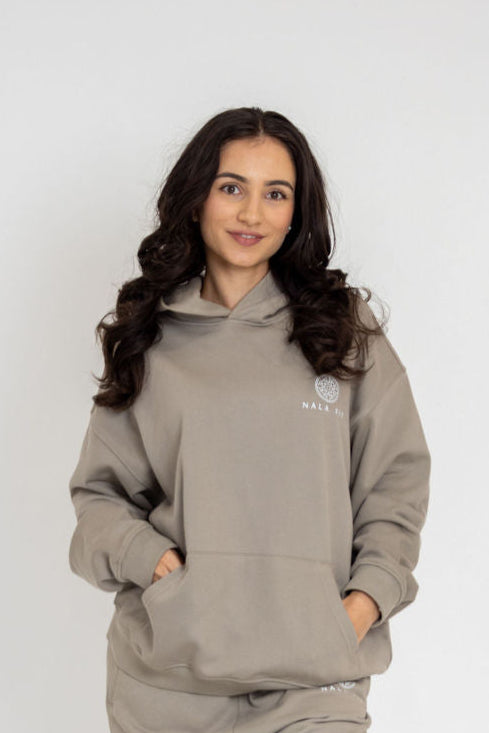 Sahara Hoodie - Camel
80% cotton, 20% polyester
440gsm cotton 
Made in China 
Hand wash
Pull-on styling
Attached hood with front and back printed logo 
Front pocket 
Oversized weighted  jersey fabric