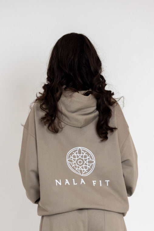 Sahara Hoodie - Camel
80% cotton, 20% polyester
440gsm cotton 
Made in China 
Hand wash
Pull-on styling
Attached hood with front and back printed logo 
Front pocket 
Oversized weighted  jersey fabric